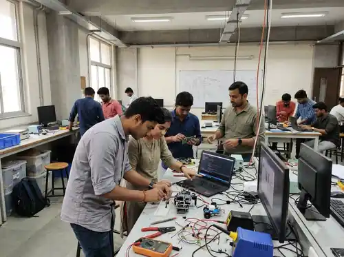 Students practicing technical skills in a computer lab